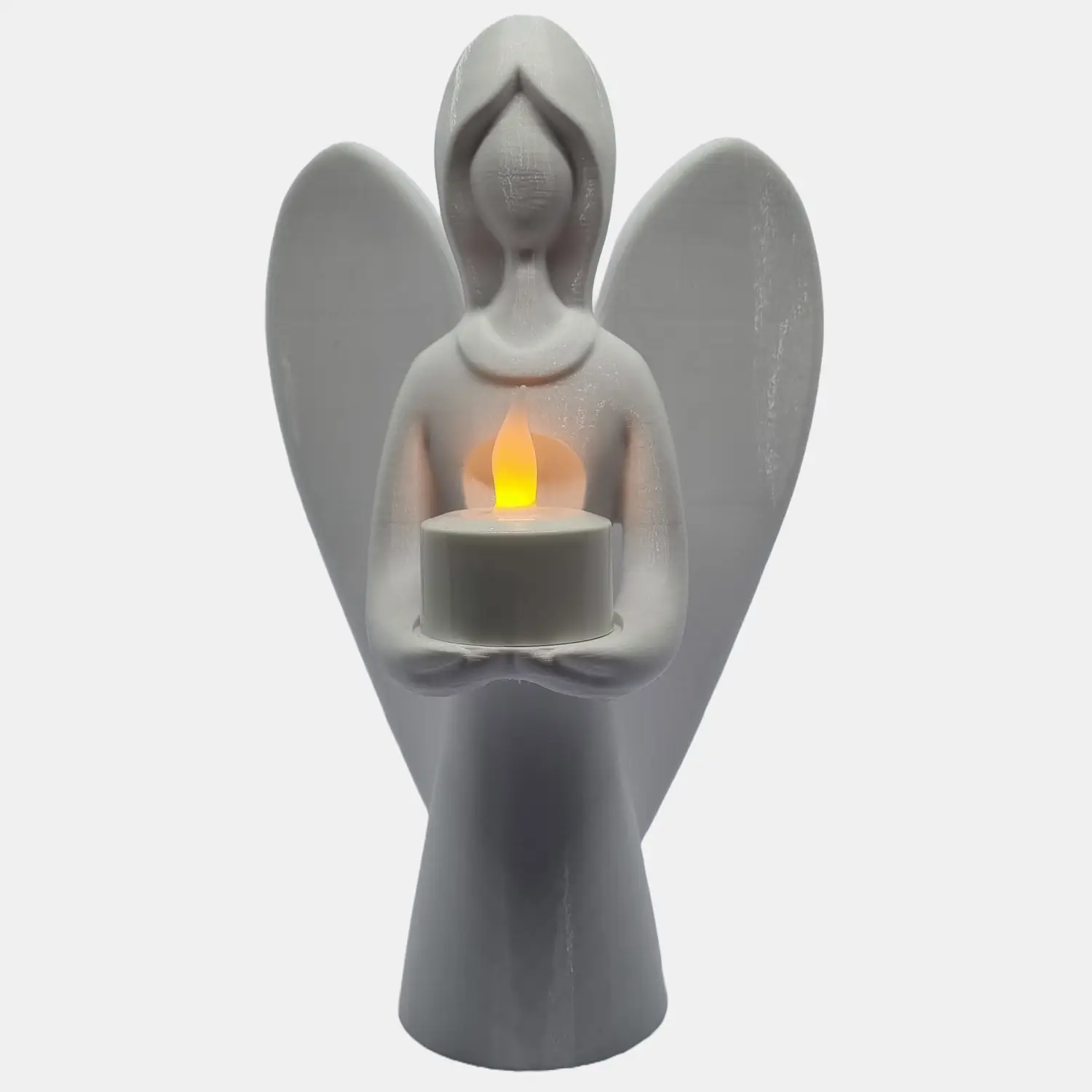 3D-printet engel der holder et elektrisk LED-fyrfadslys.